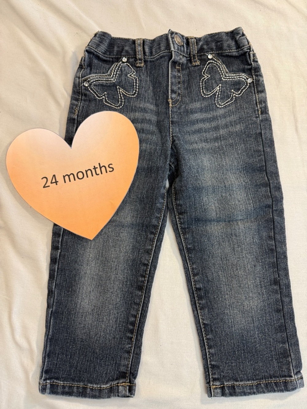 Arizona Jean Co - Denim pants with butterfly design on the front. Size 24 months